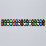Load image into Gallery viewer, A vertical row of small toy race cars attached to a black strap, laid on a plaid blanket. The cars are multicolored, including blue, green, red, orange, white, and black, and no brand is clearly visible.
